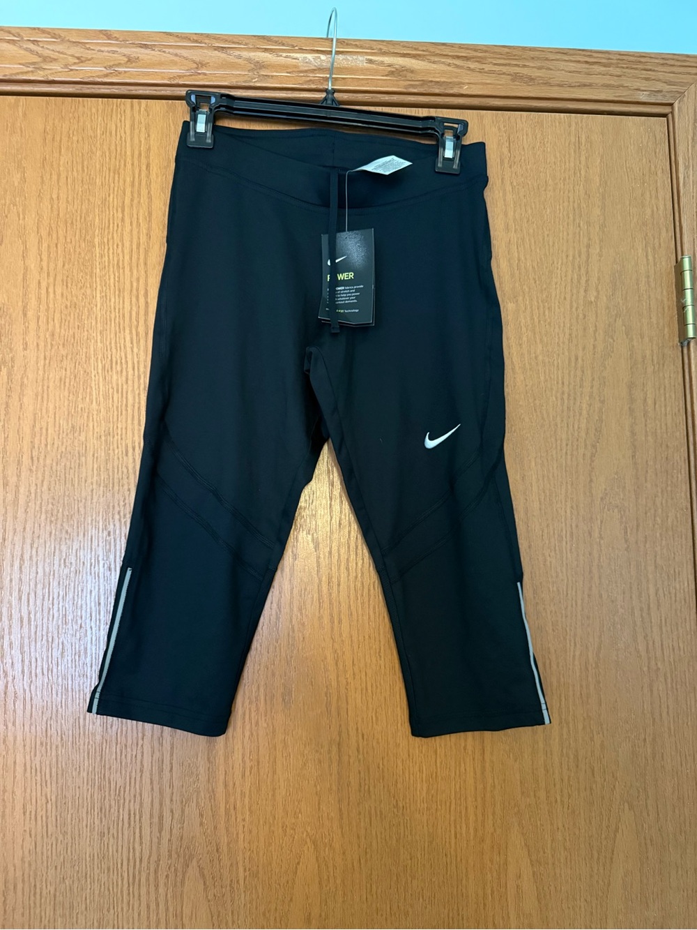 Nike Black Cropped Leggings with White Swoosh
